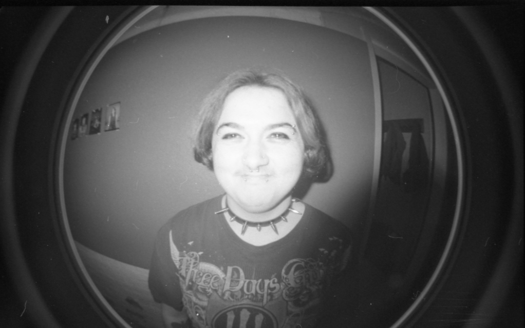 Picture of a person smiling using a fisheye lens.