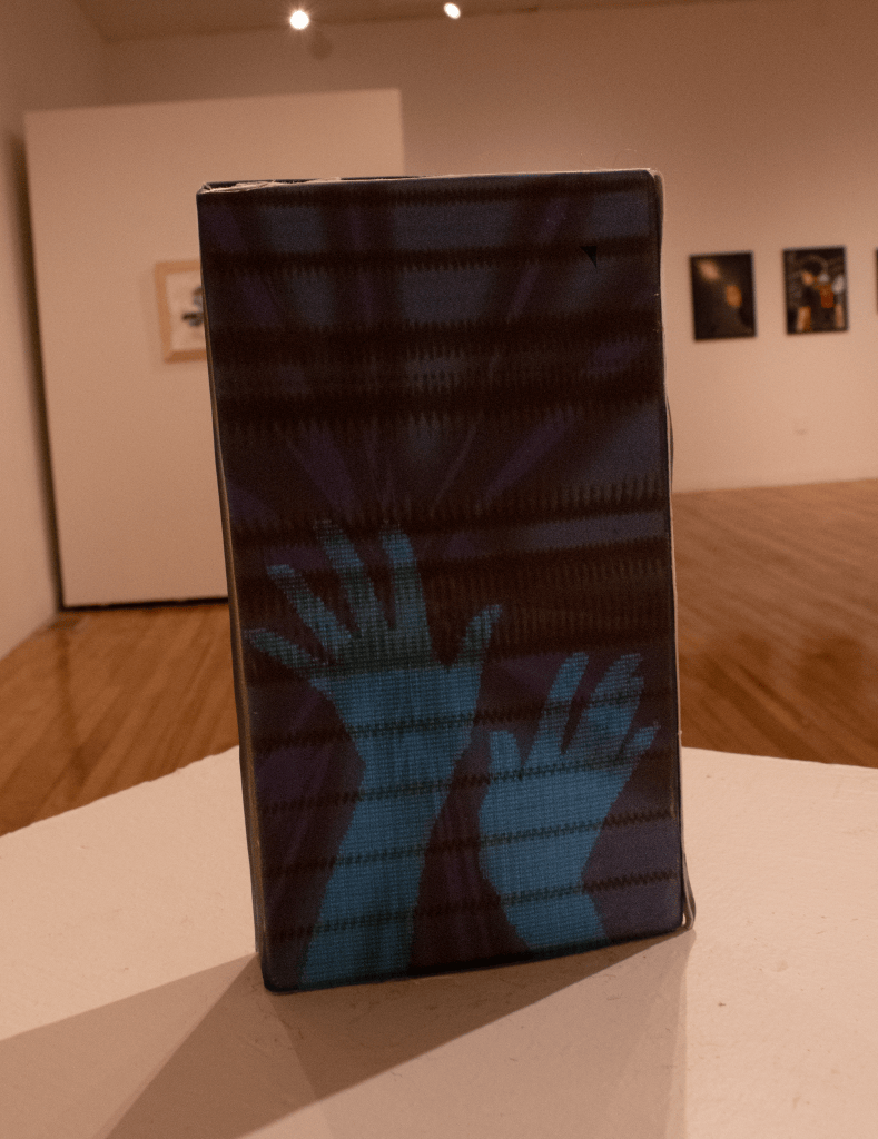 another angle of the printed digital collage in the form of a VHS.
